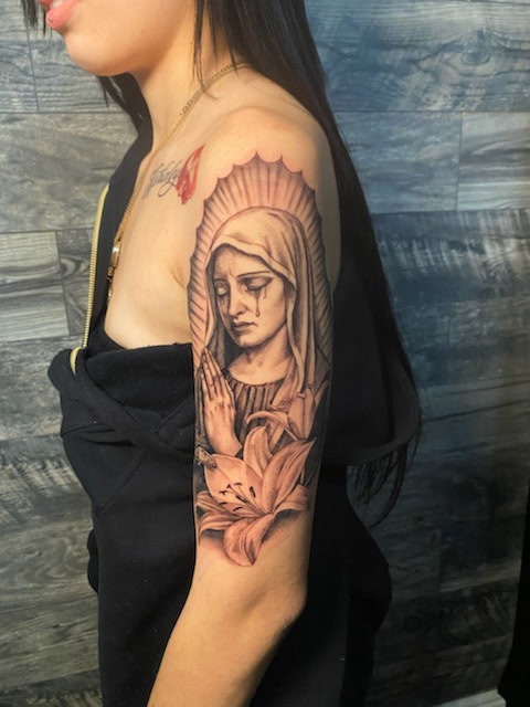 Black and grey Virgin Mary shoulder sleeve tattoo at Darkstar Tattoo Riverside CA