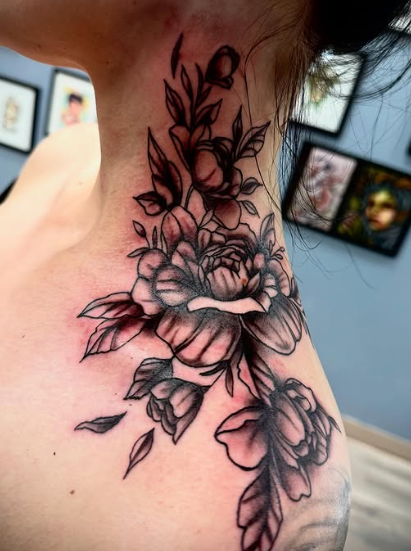 Black and grey floral neck and shoulder tattoo at Darkstar Tattoo Riverside CA