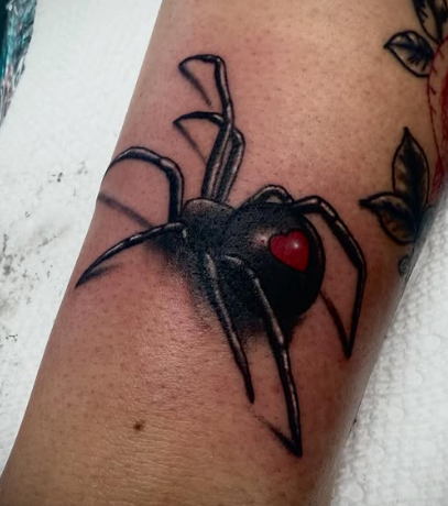 Black widow spider color tattoo at Darkstar Tattoo Riverside CA
