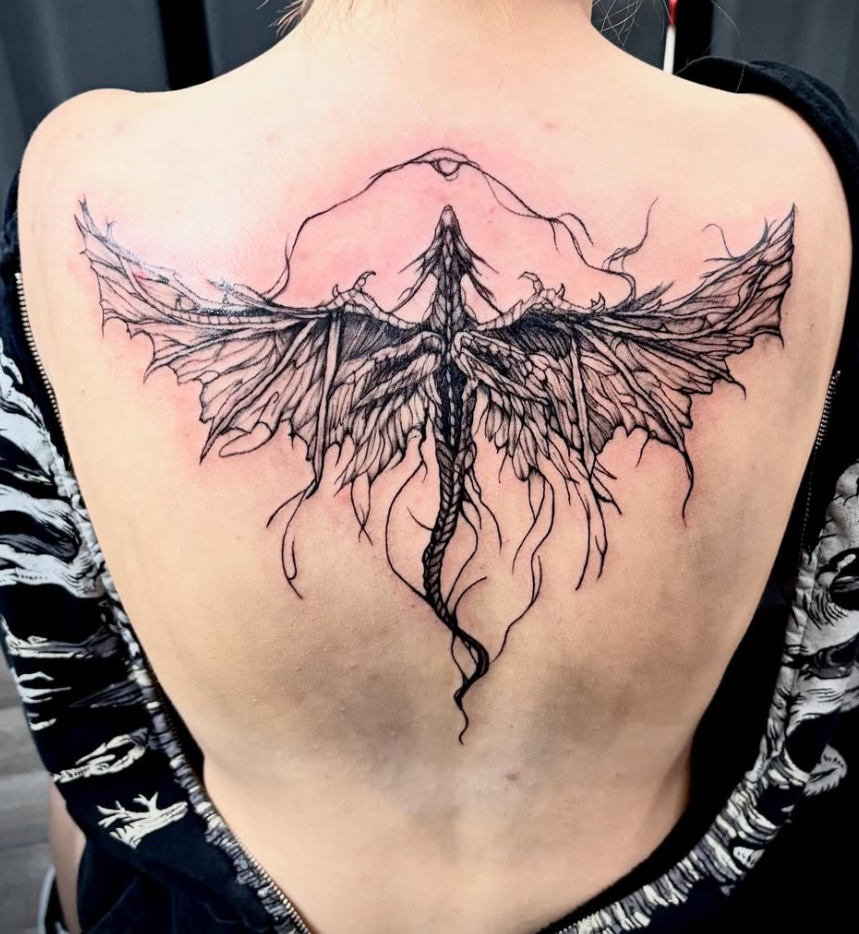 Fine line dragon back tattoo at Darkstar Tattoo Riverside CA