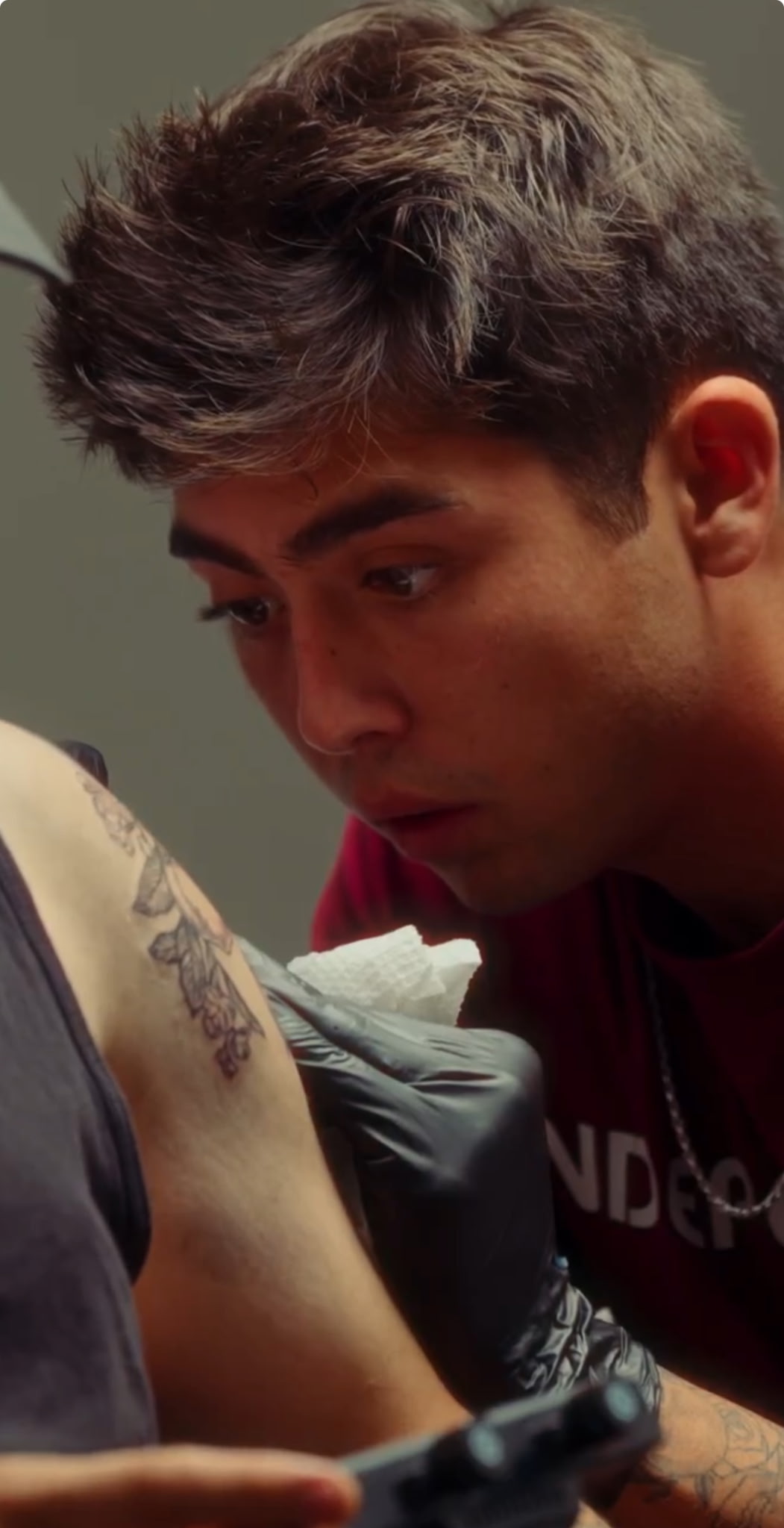Jared Gonzalez tattooing a leg piece at Darkstar Tattoo Riverside CA