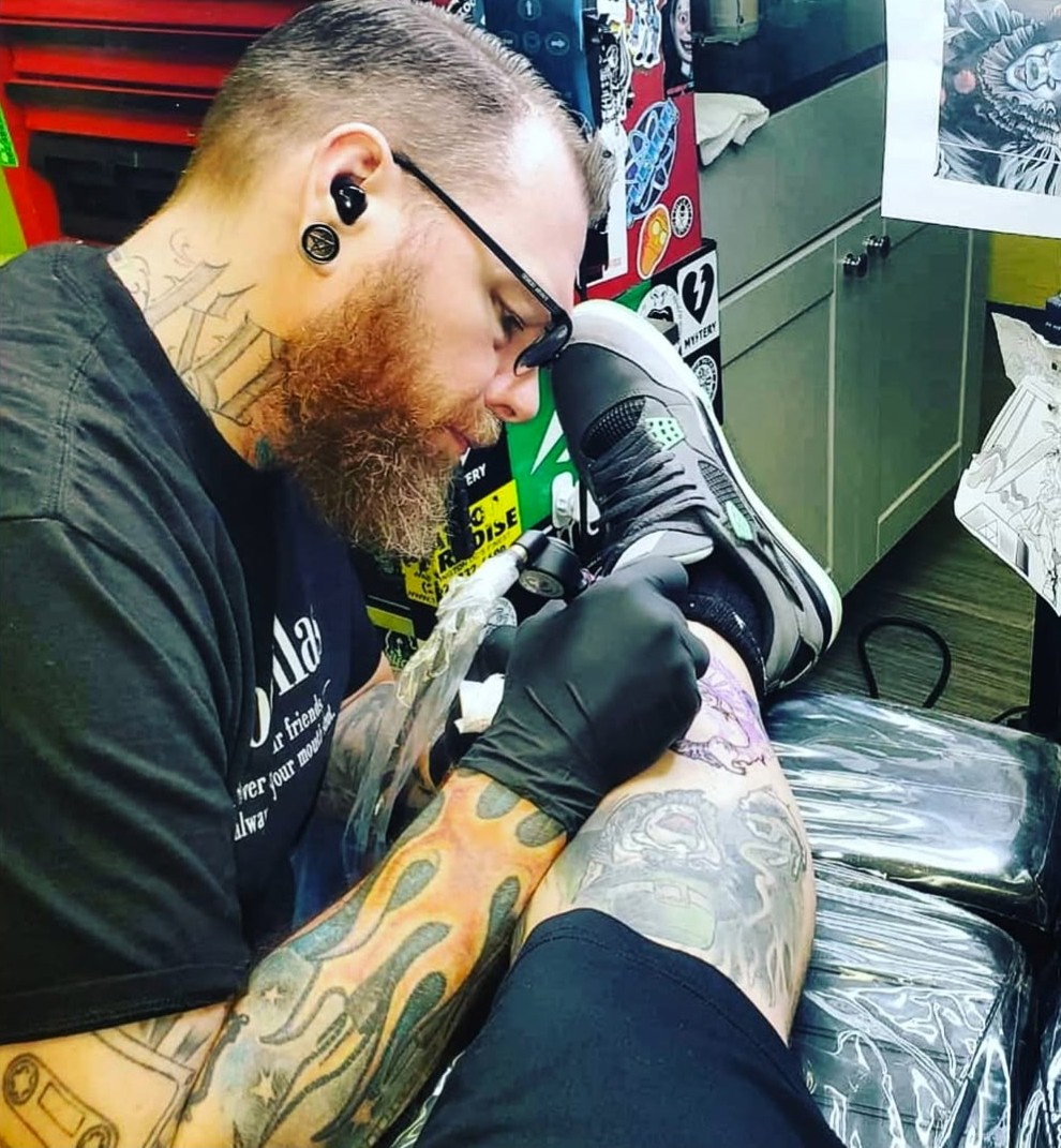 Kevin Owings tattooing a client at Darkstar Tattoo Riverside CA
