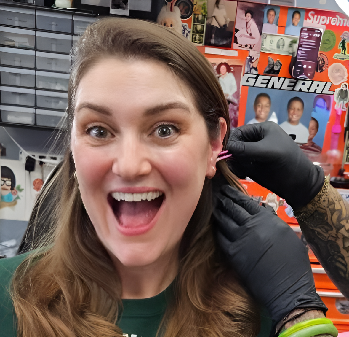 Happy client getting an ear piercing at Darkstar Tattoo Riverside CA