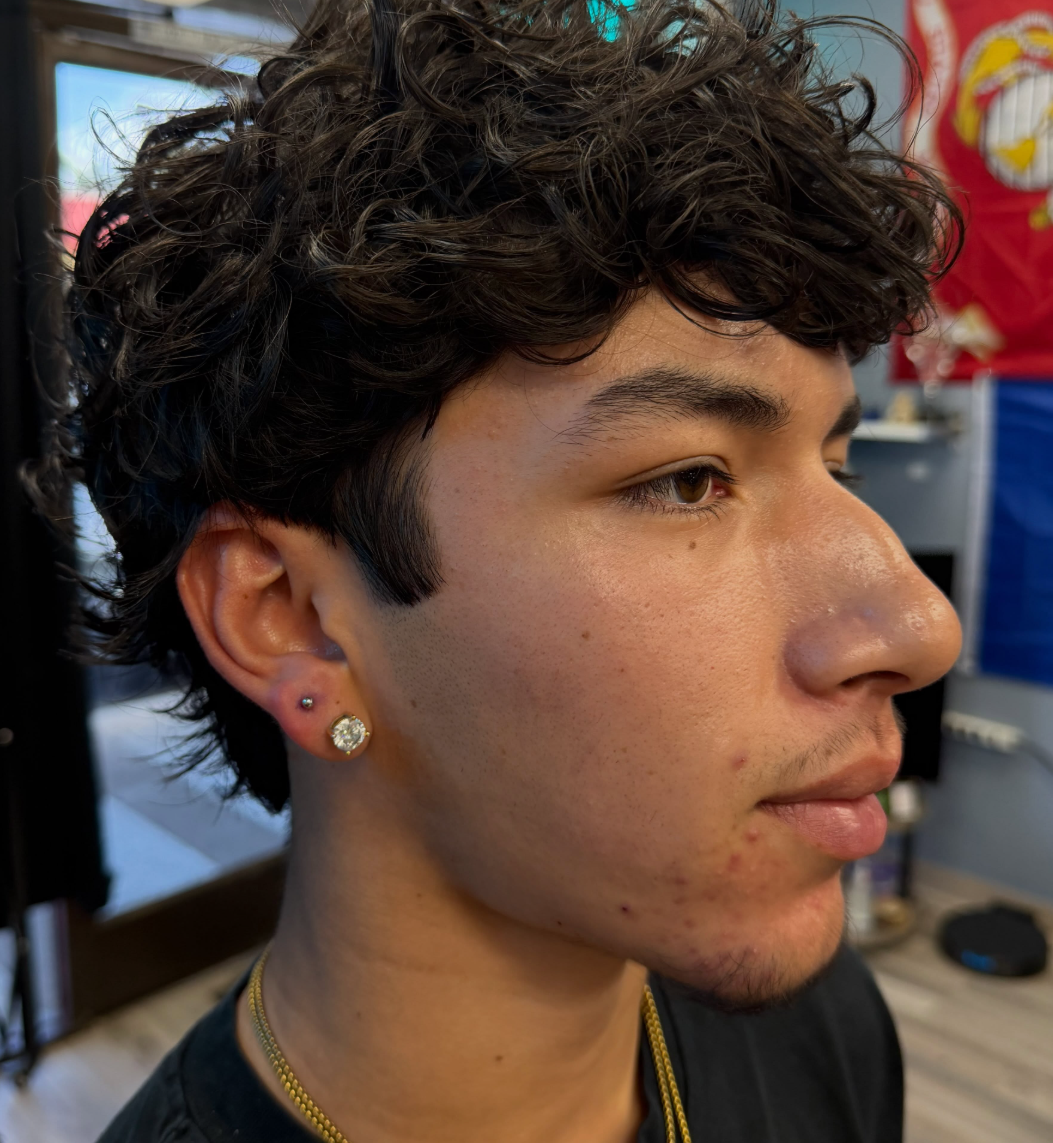 Men's ear piercing at Darkstar Tattoo Riverside CA