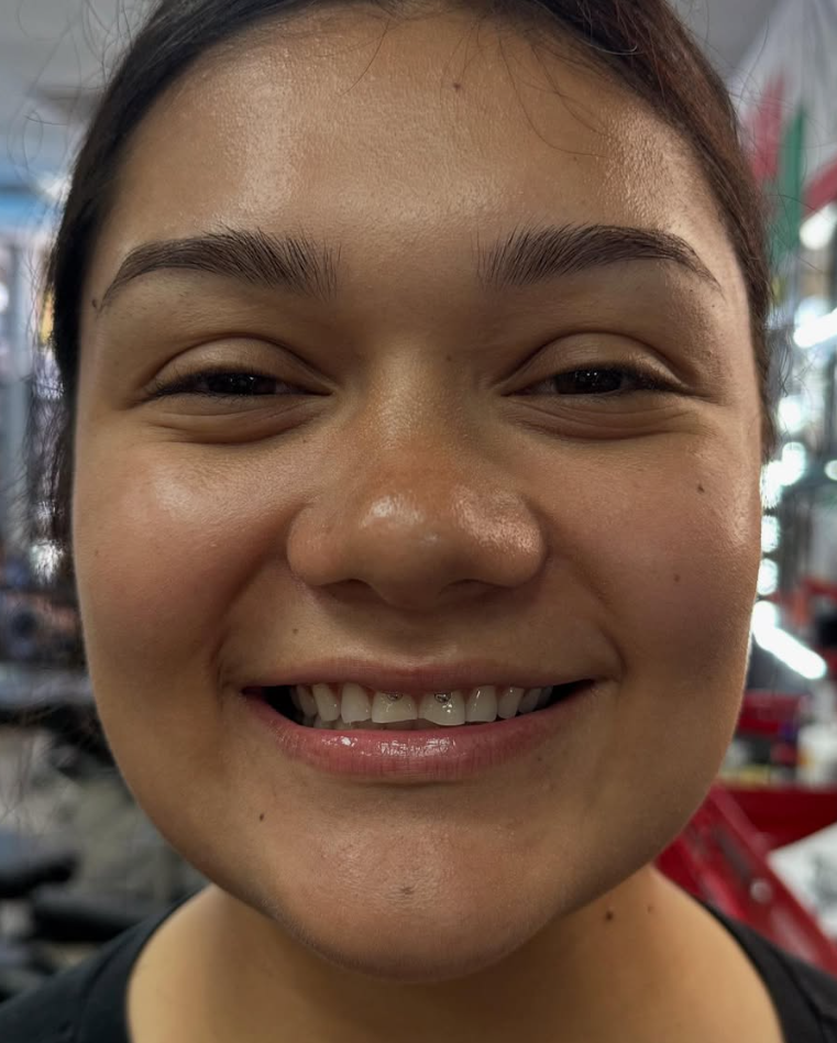 Tooth gem smile result at Darkstar Tattoo Riverside CA