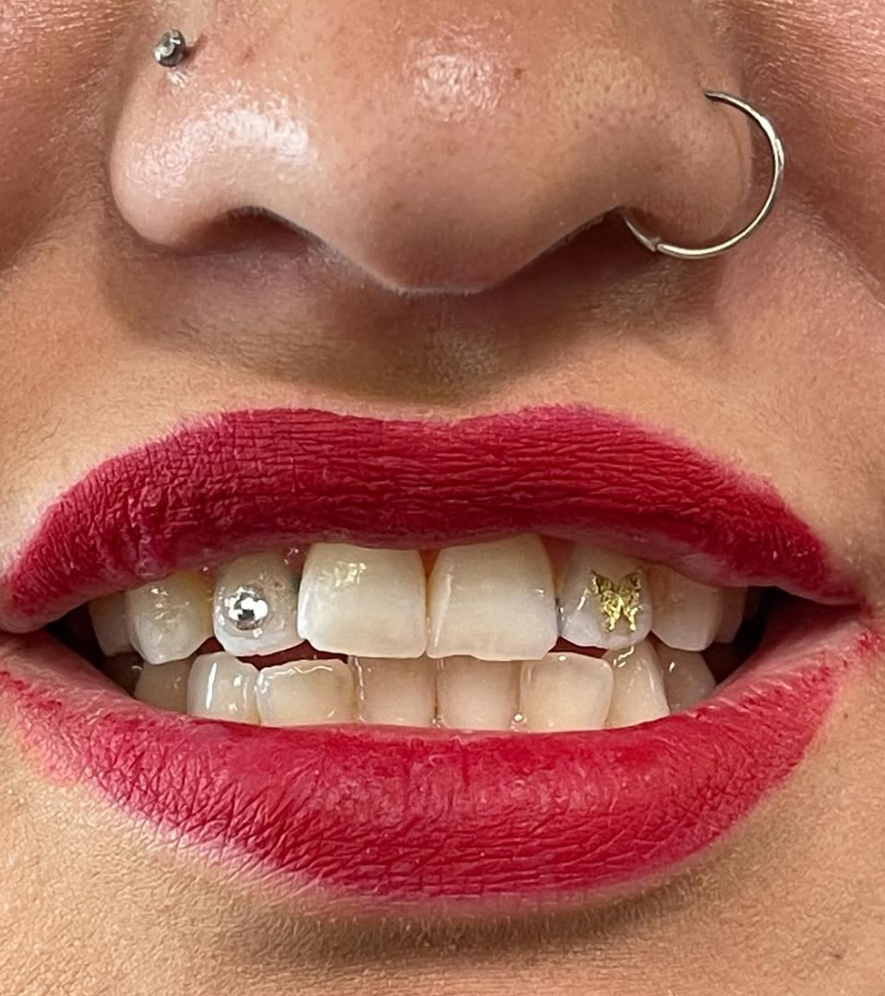 Crystal and gold star tooth gems at Darkstar Tattoo Riverside CA