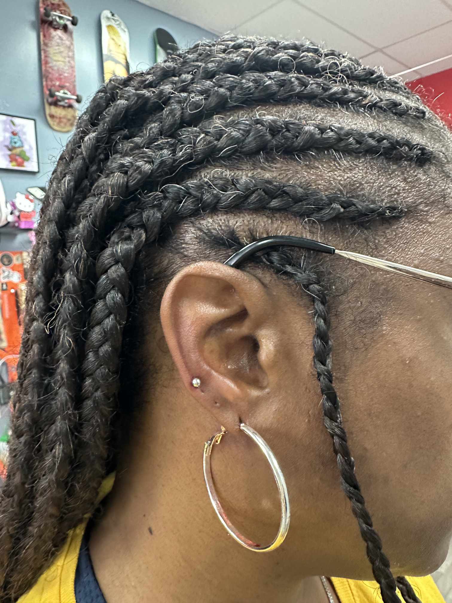 Double ear piercing with hoop at Darkstar Tattoo Riverside CA
