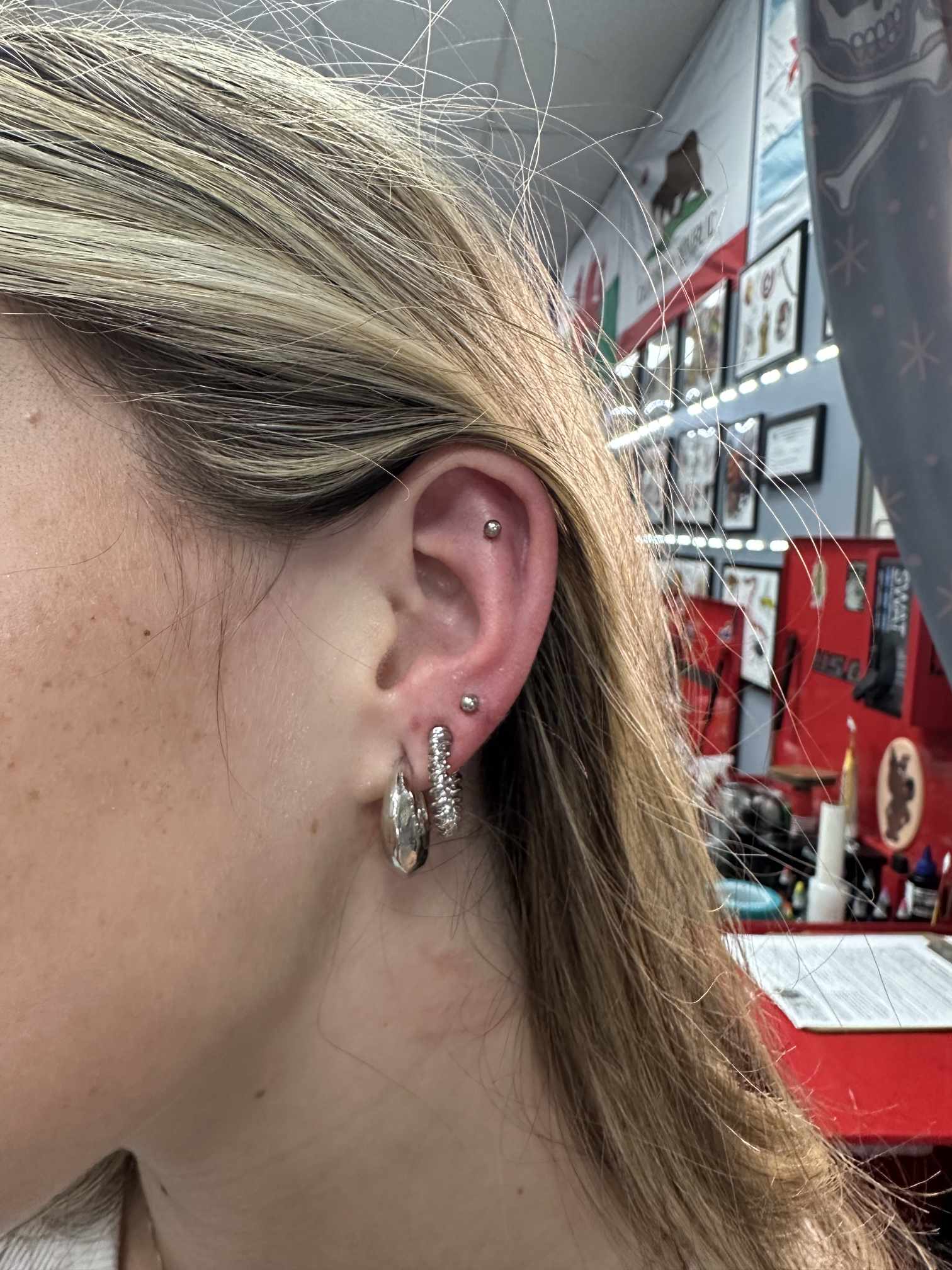 Tragus and helix ear piercing at Darkstar Tattoo Riverside CA