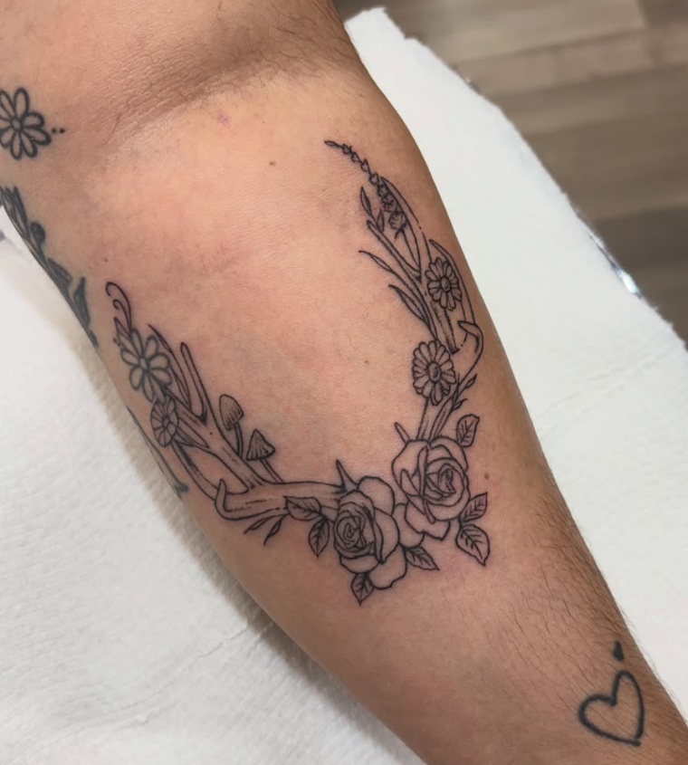 Fine line floral wreath tattoo by Looney at Darkstar Tattoo Riverside CA