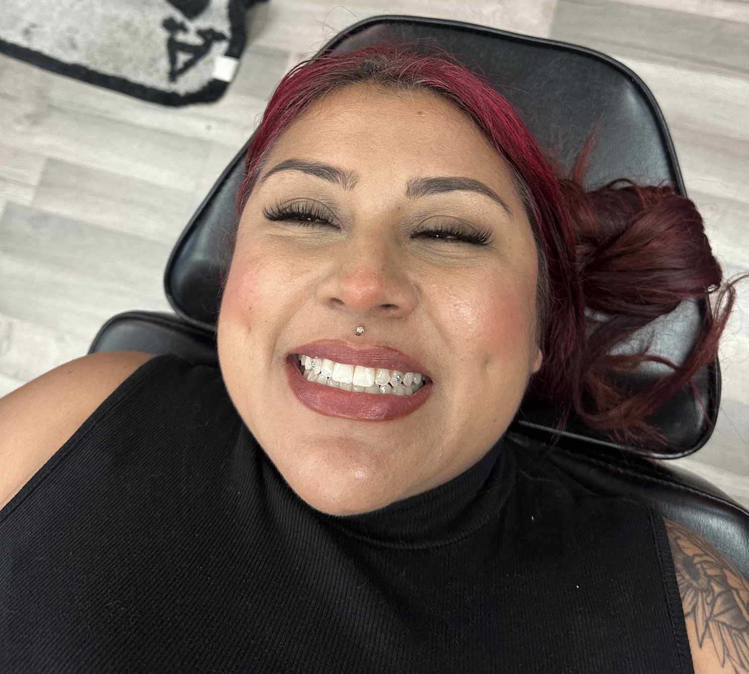 Tooth gem smile result at Darkstar Tattoo Riverside CA