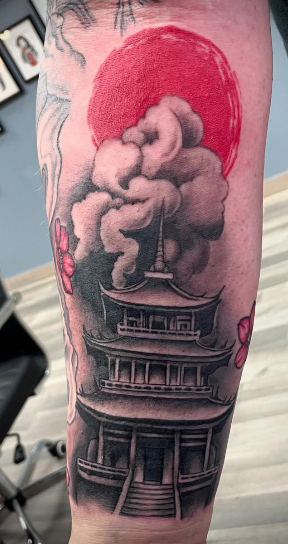 Japanese pagoda and red sun forearm tattoo at Darkstar Tattoo Riverside CA
