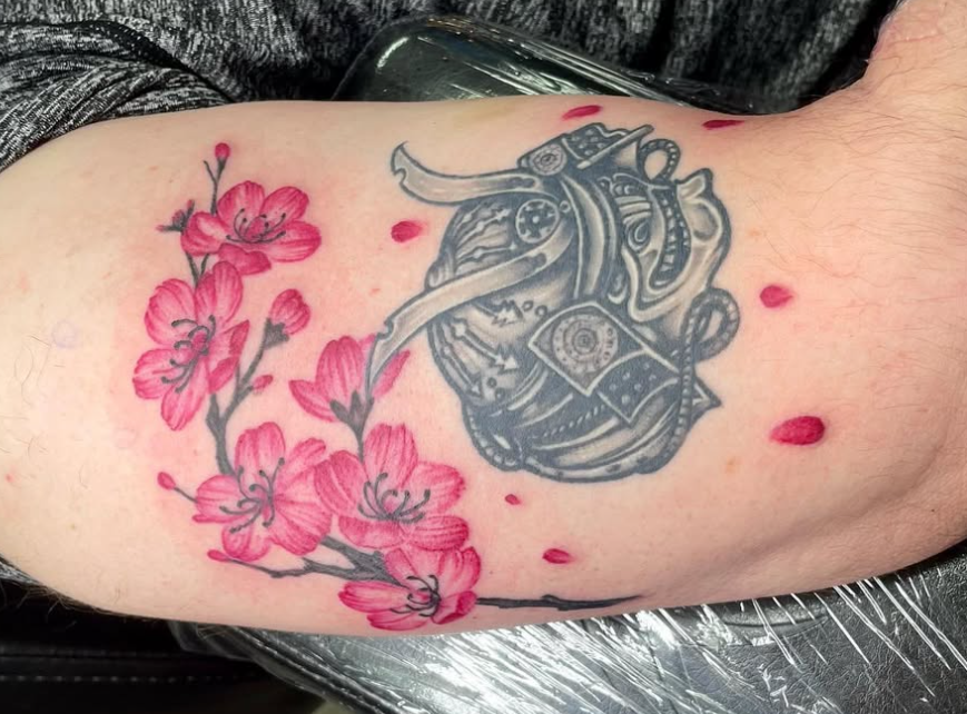 Japanese samurai helmet and cherry blossom arm tattoo at Darkstar Tattoo Riverside CA