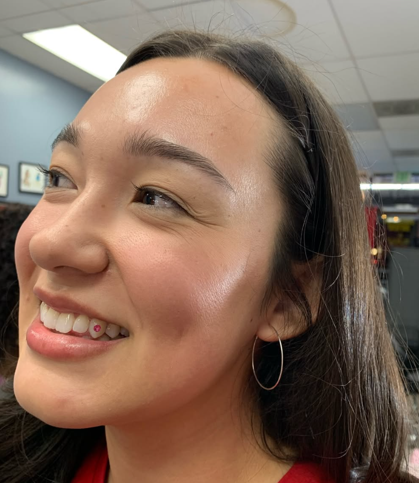 Tooth gem smile result at Darkstar Tattoo Riverside CA