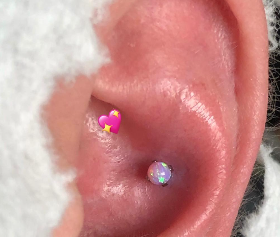 Opal cartilage piercing by Nick Sida at Darkstar Tattoo