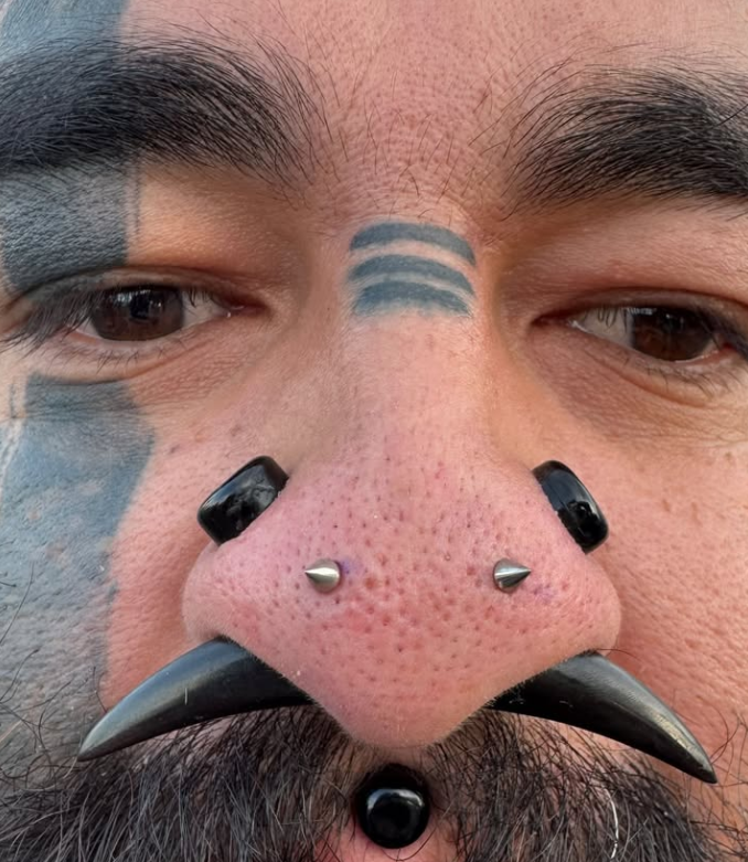 Septum piercing by Nick Sida at Darkstar Tattoo